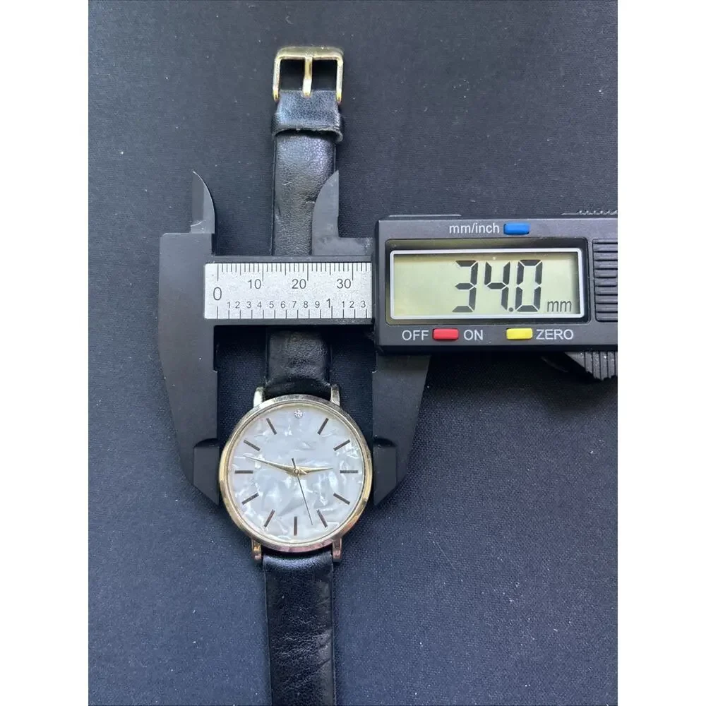 Gold Tone Pearlized Dial Black Band Women’s Quartz Watch